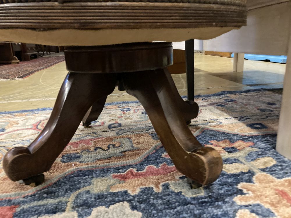 A Victorian leather upholstered mahogany swivel desk chair